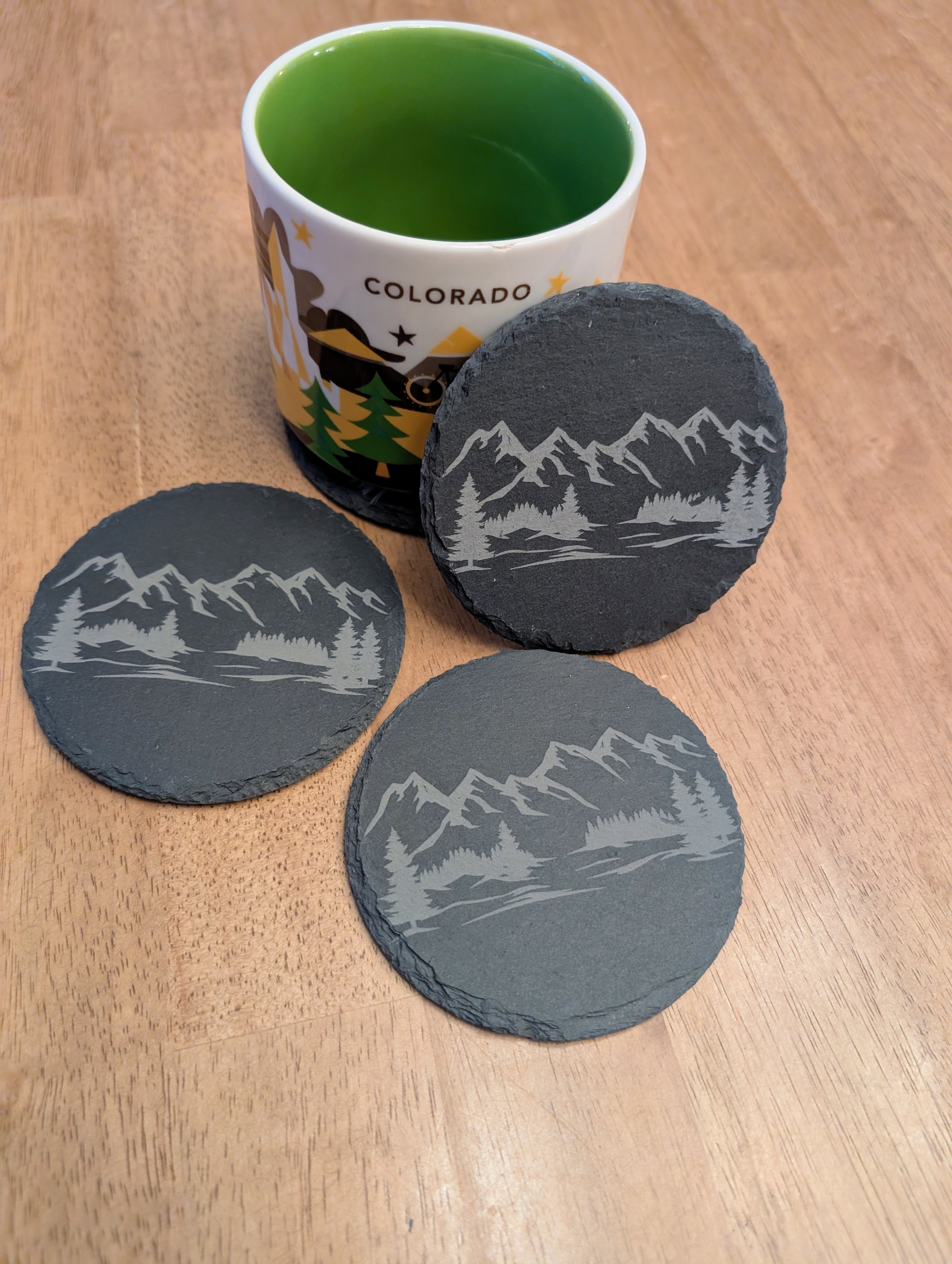 Laser engraved slate coasters with Colorado mountain scene