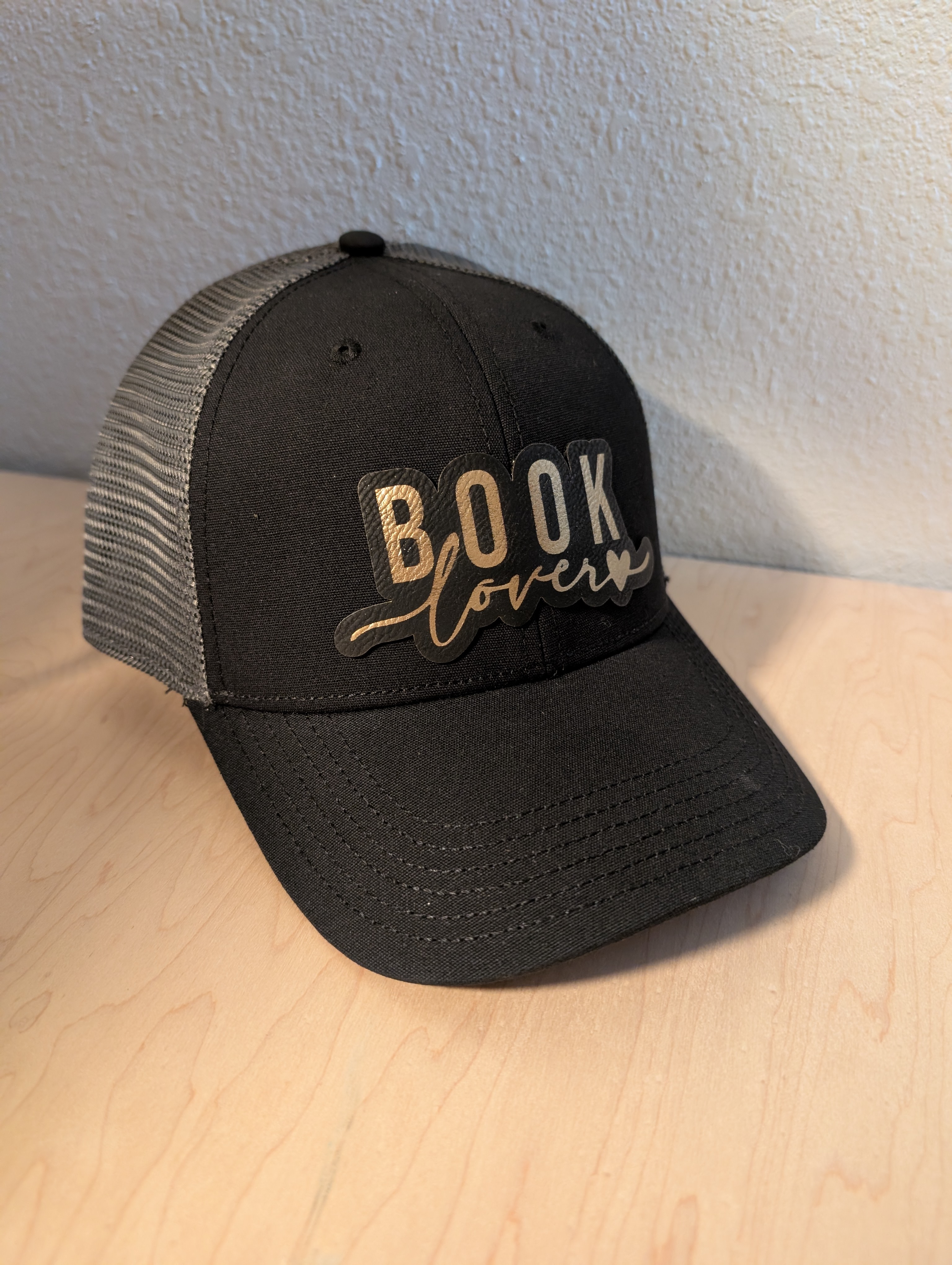 Hat with custom leatherette patch
