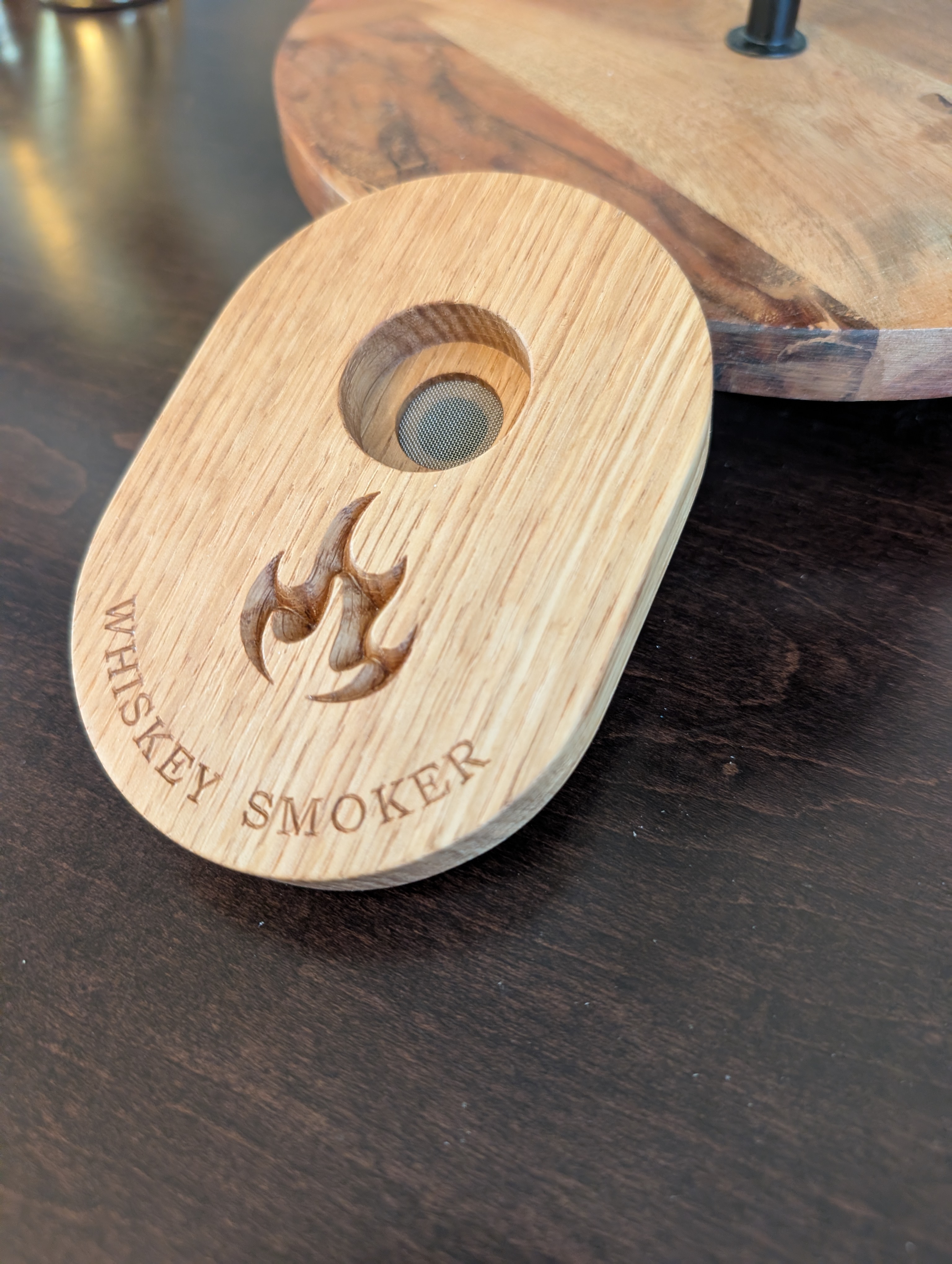 Close-up of custom whiskey smoker showing flame engraving detail - white oak